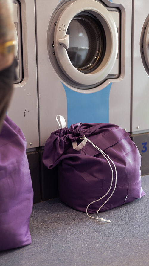 Folded laundry returned in a daily. bag — Brisbane pickup, wash, fold and delivery